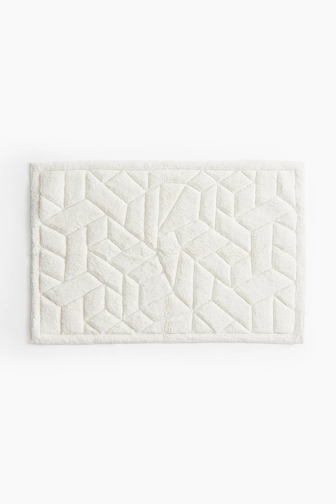 Tapis de bain en coton bouclé