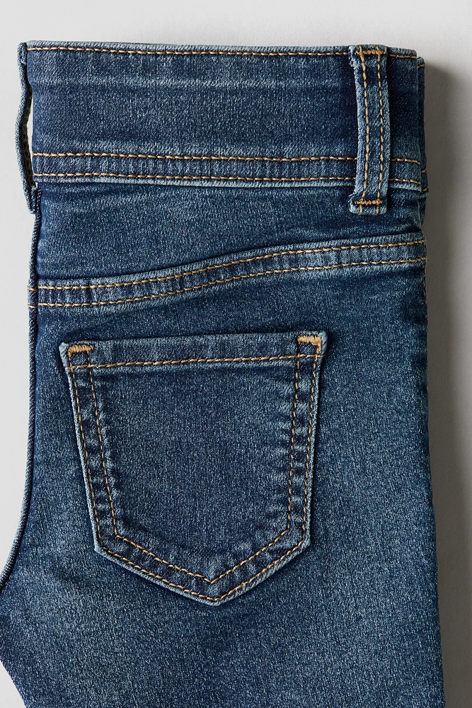 Jean très extensible à jambes évasées