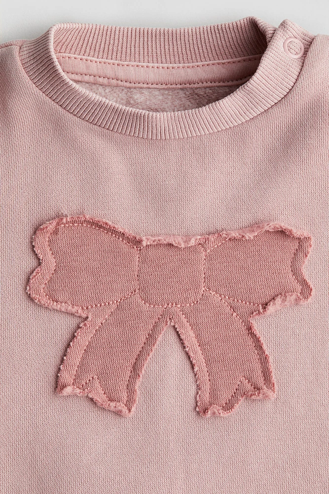 Chandail en molleton avec appliqué