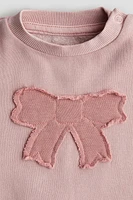 Chandail en molleton avec appliqué