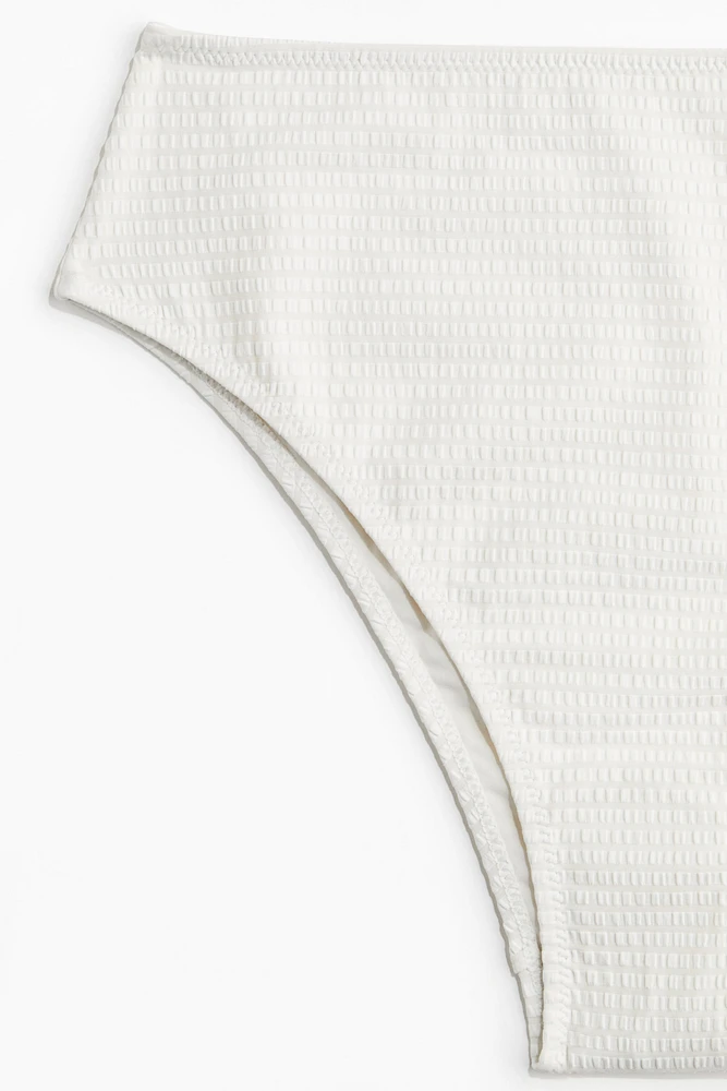 Bas de maillot échancré taille haute