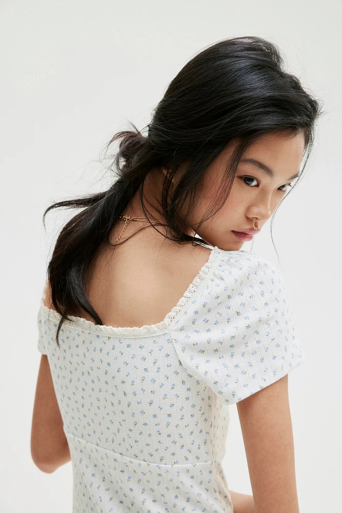 Lace-Trimmed Dress with Flared Skirt