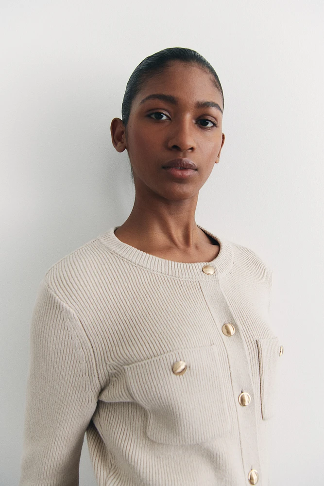 Robe en tricot avec poches devant