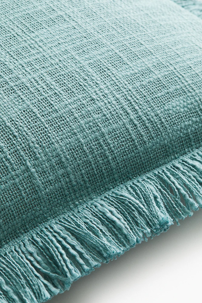 Housse de coussin en tissu flammé