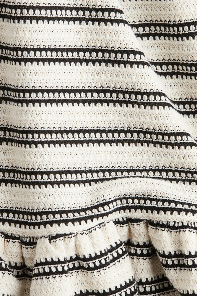 Robe volantée en tricot