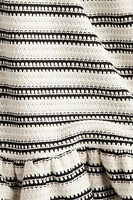 Robe volantée en tricot