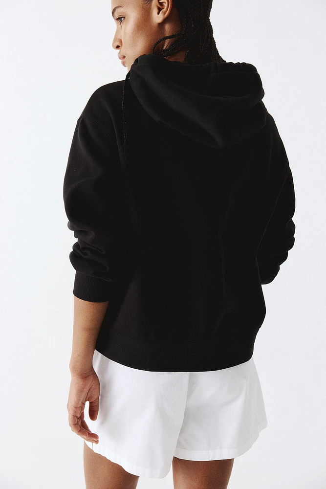 Veste à capuchon glissière