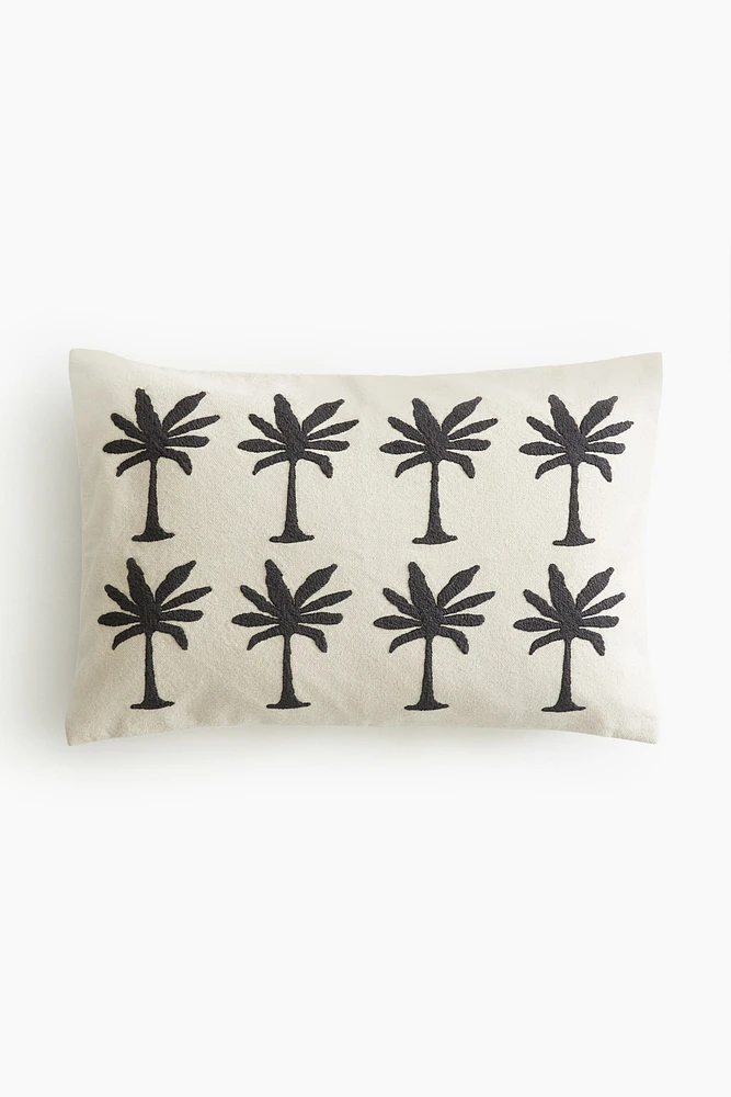 Housse de coussin brodée