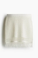 Fringe-trimmed pointelle-knit skirt