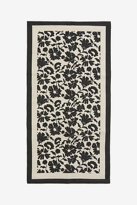 Tapis fleuri en toile de coton