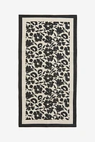 Tapis fleuri en toile de coton