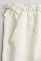 Pantalon avec détails à nouer