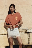 Fringe-trimmed pointelle-knit skirt