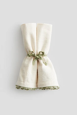 Lot de 2 serviettes de table à bords festonnés
