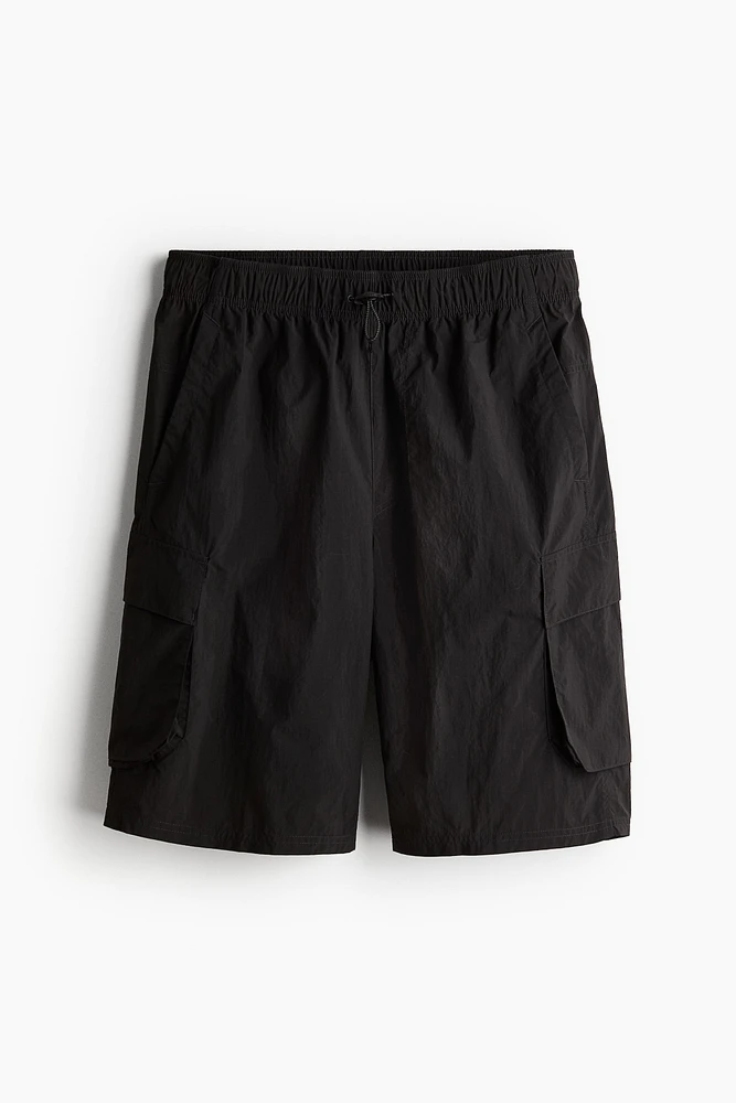 Short cargo long de sport