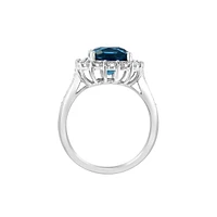 Sterling Silver, Long Blue Topaz & 0.24 CT. T.W. Diamond Halo Ring