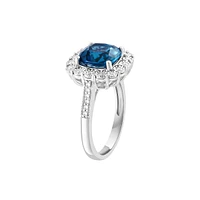 Sterling Silver, Long Blue Topaz & 0.24 CT. T.W. Diamond Halo Ring