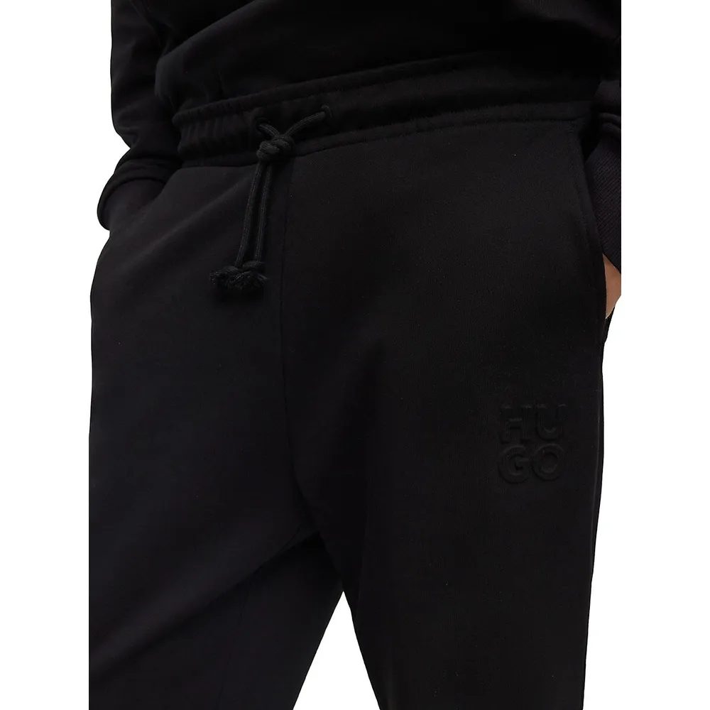 Relaxed Stacked Embossed Logo Trackpants