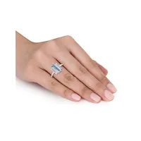 14K White Gold, Blue Topaz and 0.14 CT. T.W. Diamond Solitaire Ring