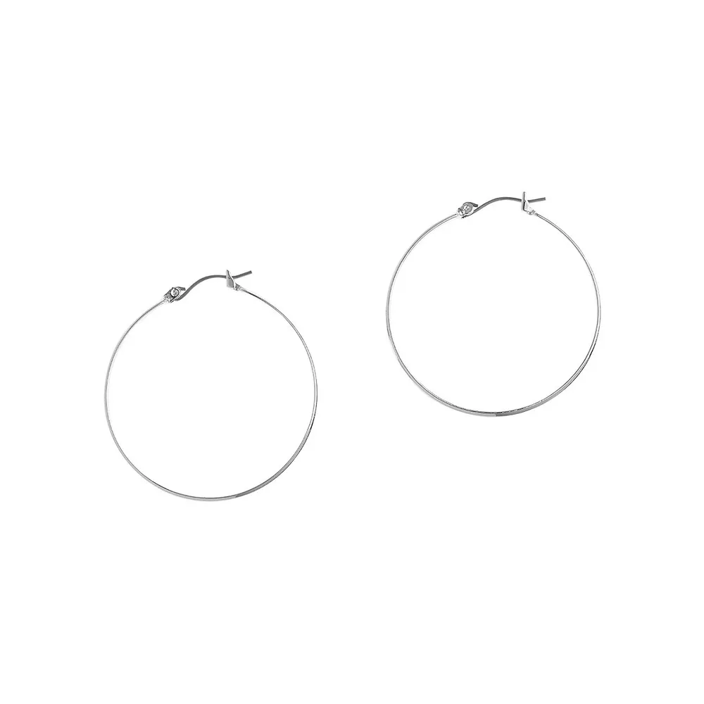 Basic large hoop earrings in silver tone metal.