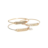 Ensemble de trois bracelets joncs ton or rose à fermeture à tension