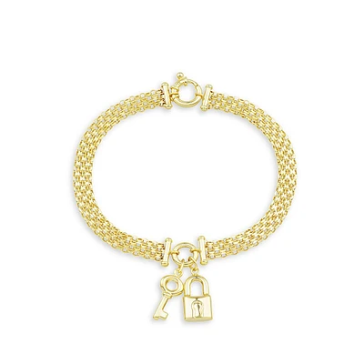 Bracelet en or jaune 14 ct avec breloques de cadenas et de clé.