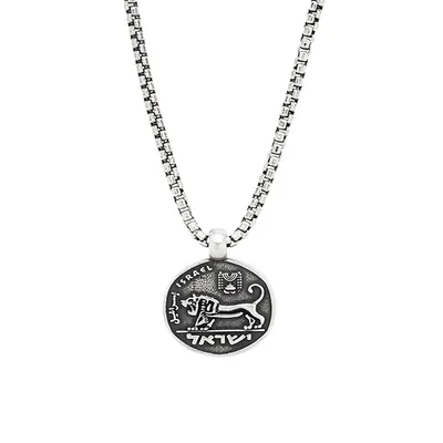 En argent sterling, ce collier à pendentif présente une ancienne pièce de monnaie israélienne en forme de lion