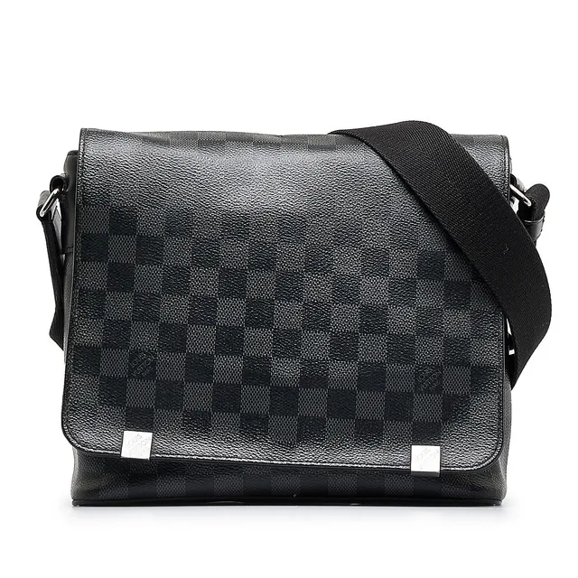 This Louis Vuitton Toletry Pouch in Damier Graphite canvas will protect  your shaving tools and treatments.