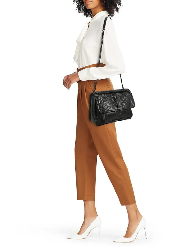 Shop Khaite Augusta Envelope Pleat Frame Leather Crossbody Bag