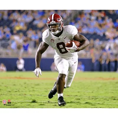 Tua Tagovailoa Alabama Crimson Tide Unsigned White Jersey Holding Up National Championship Trophy Photograph