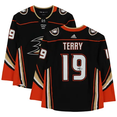 Troy Terry Anaheim Ducks Autographed 8 x 10 White Jersey with Puck Photograph
