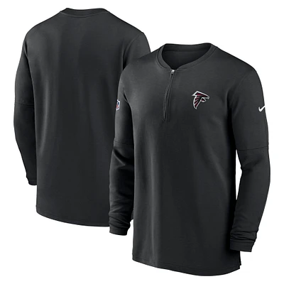 Haut Nike noir Atlanta Falcons 2023 Sideline Performance à manches longues et quart de zip pour homme