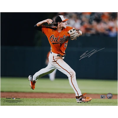Gunnar Henderson Baltimore Orioles Autographed 16" x 20" Orange Jersey Throwing Photograph