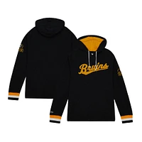 Sweat à capuche raglan légendaire du 100e anniversaire des Bruins de Boston noir Mitchell & Ness pour hommes