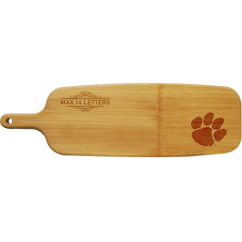 https://cdn.mall.adeptmind.ai/https%3A%2F%2Fimages.footballfanatics.com%2Fclemson-tigers%2Fclemson-tigers-personalized-bamboo-paddle-serving-board_pi4451000_ff_4451415-9044c28eabdacb691424_full.jpg%3F_hv%3D2_large.webp