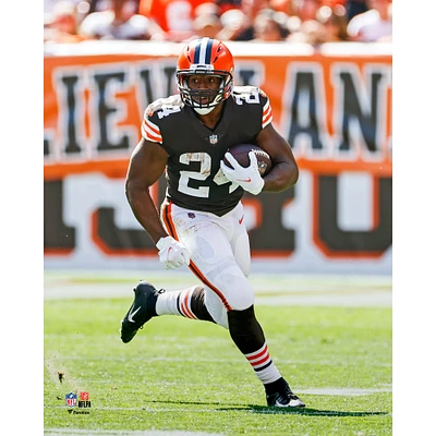 Cleveland Browns Nick Chubb Unsigned Brown Jersey Carrying Ball Photograph