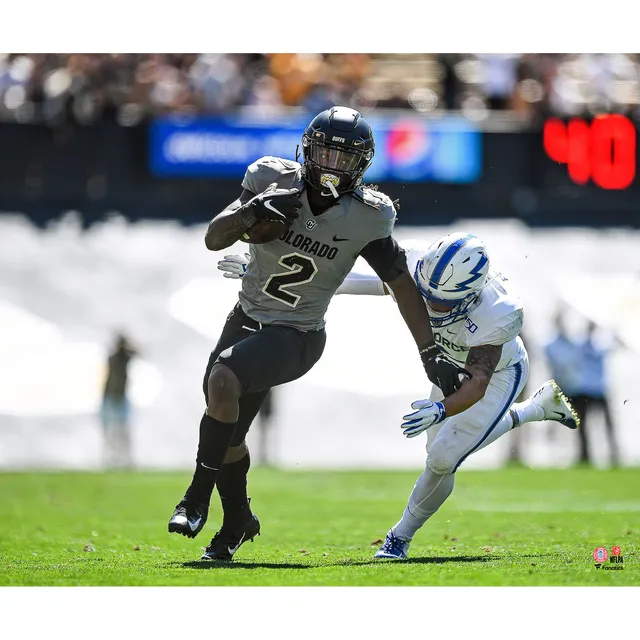 Taysom Hill New Orleans Saints Unsigned Carries The Ball in Black Jersey Photograph