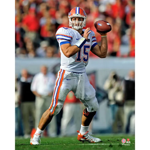 Tim Tebow Florida Gators Unsigned White Jersey Running Photograph