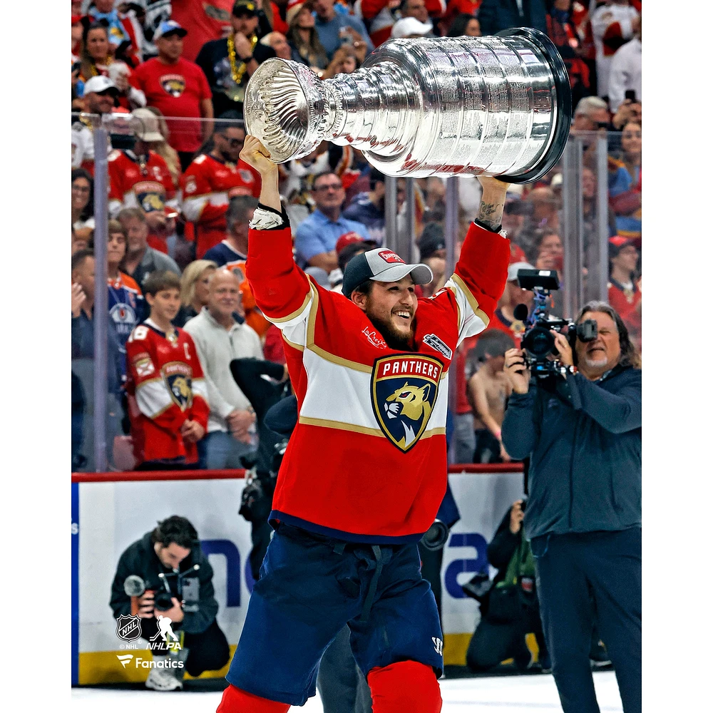 Brandon Montour Florida Panthers Unsigned 2024 Stanley Cup Champions Raising Photograph