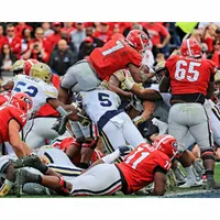 D'Andre Swift Georgia Bulldogs Unsigned White Jersey Stiff Arm vs.  Tennessee Photograph