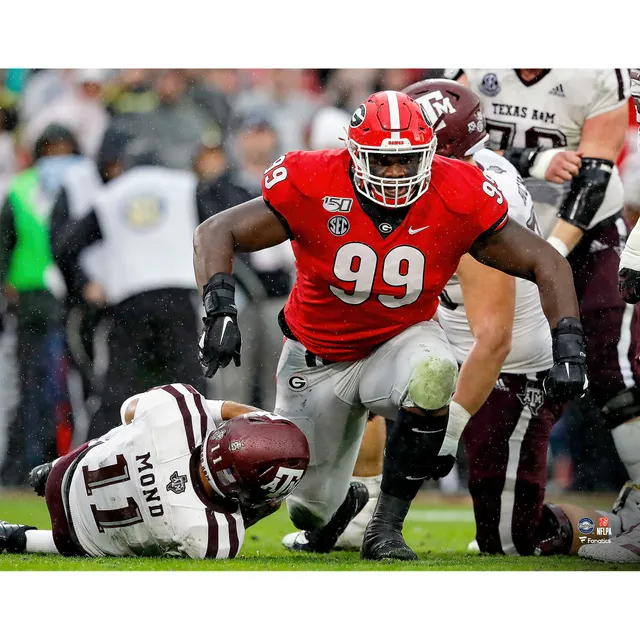 Myles Garrett Cleveland Browns Unsigned Celebrates A Sack in White Jersey Photograph