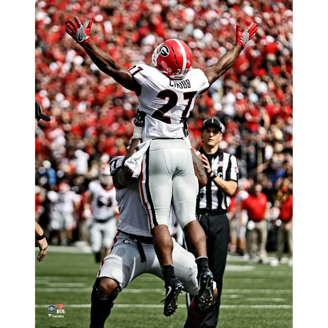 Cleveland Browns Nick Chubb Unsigned Brown Jersey Carrying Ball Photograph