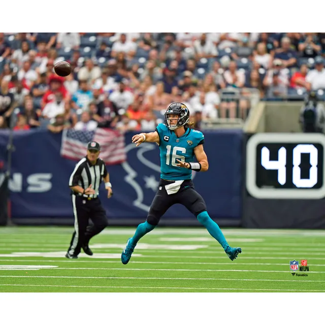 Trevor Lawrence Jacksonville Jaguars Unsigned White Jersey Scrambling  Photograph