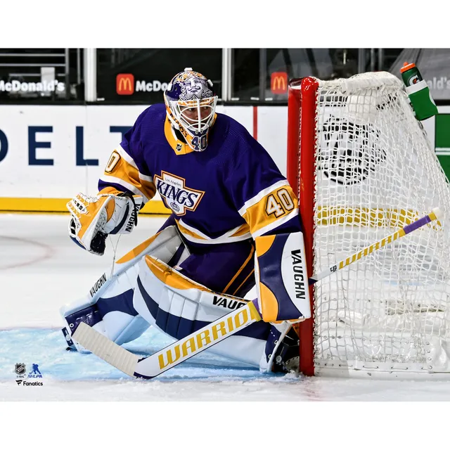 Connor Hellebuyck Winnipeg Jets Unsigned Reverse Retro Jersey in Net Photograph