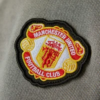 Haut demi-zippé adidas Originals Manchester United gris pour homme