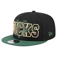 Men's New Era Black/Hunter Green Milwaukee Bucks Sport Night Splatter Two-Tone Snapback 9FIFTY Snapback Hat