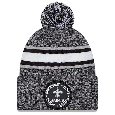 Bonnet en tricot à revers New Era Heather Black New Orleans Saints 2023 Inspire Change pour hommes avec pompon