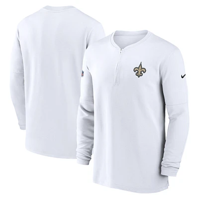 Haut Nike blanc New Orleans Saints 2023 Sideline Performance à manches longues tri-mélange et quart de zip pour homme