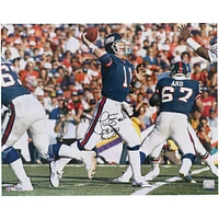 Phil Simms New York Giants Autographed 16" x 20" Throwing in Blue Photograph with "S.B. XXI M.V.P." Inscription