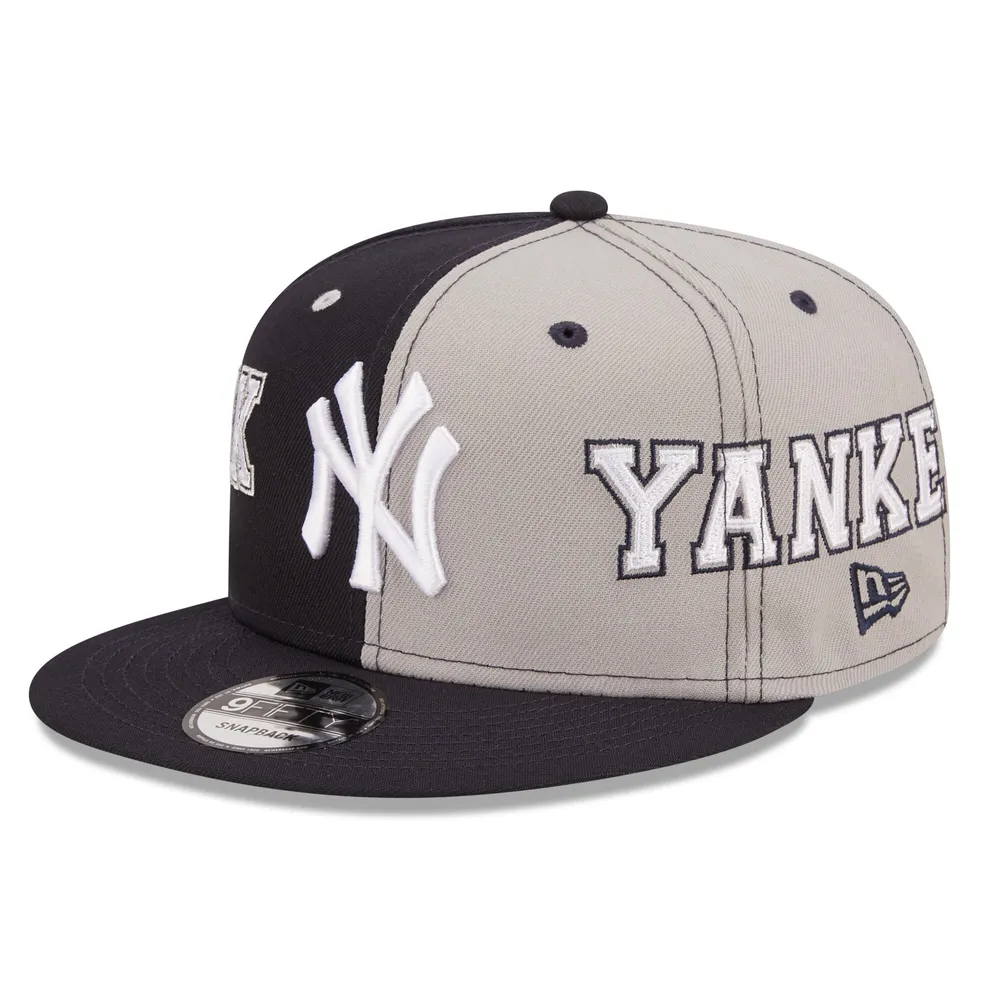 A model wears an all black outfit - New York Yankees bucket hat